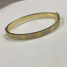 Load and play video in Gallery viewer, REVERSIBLE 10k Gold Designer Inspired Bangle with Two Wearable Designs
