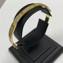 Load image into Gallery viewer, REVERSIBLE 10k Gold Designer Inspired Bangle with Two Wearable Designs
