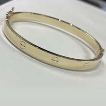 Load image into Gallery viewer, 10k Gold Designer Inspired Bangle with Screw Design

